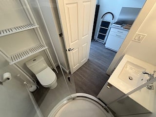 aerial view of bathroom taken from inside shower.