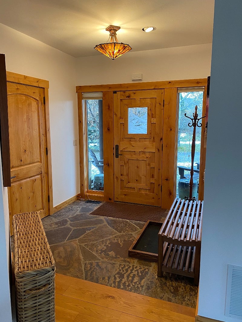 Front door, laundry room on the left