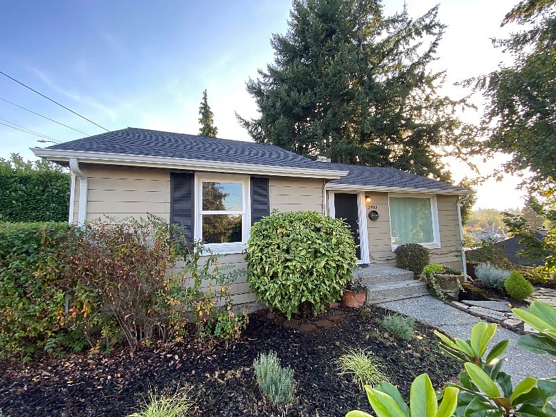 Front of house (this is the upper unit with permanent resident). round steps down front of house lead to side entrance at top of driveway for this lower 1-bedroom unit