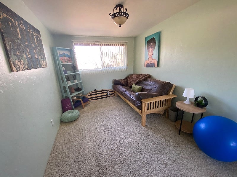 Full size futon (zen room) with yoga and meditation gear.