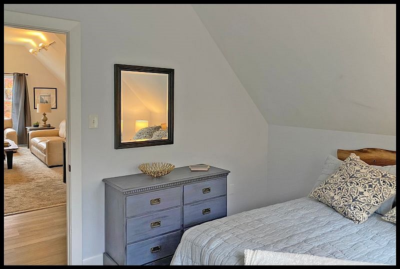 Bedroom with Dresser, Mirror, and Queen Size Bed