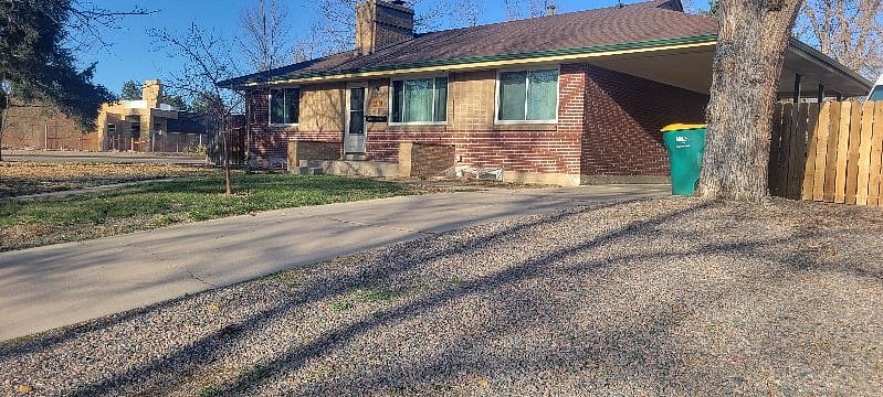 Front of the house view. Your entrance is on the left side by the gate. Park in the gravel driveway or on the street