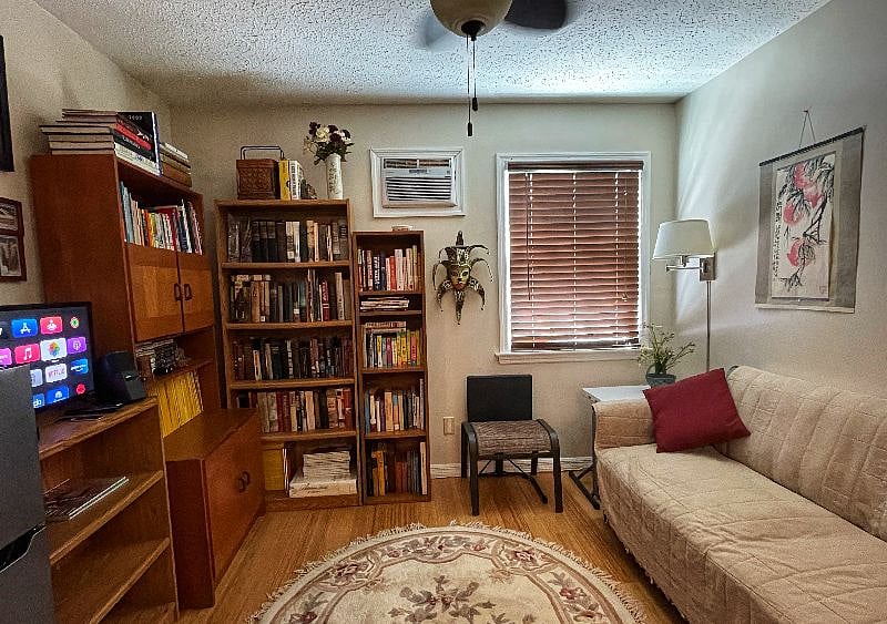 The multi-functional living room is designed for entertainment, comfort, food prep and storage.
