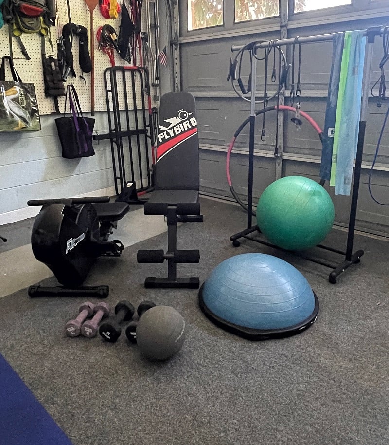 Downstairs home gym contains a weight bench, rowing machine, stability and medicine balls, bosu, stepper, dumbbells, cables and PT bands, yoga mats, .. even a hula hoop!