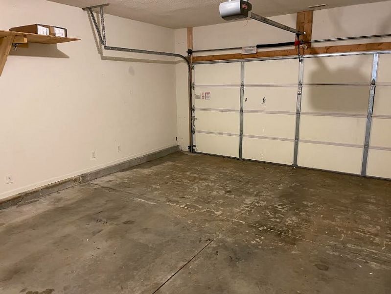 2-car attached garage with shelves