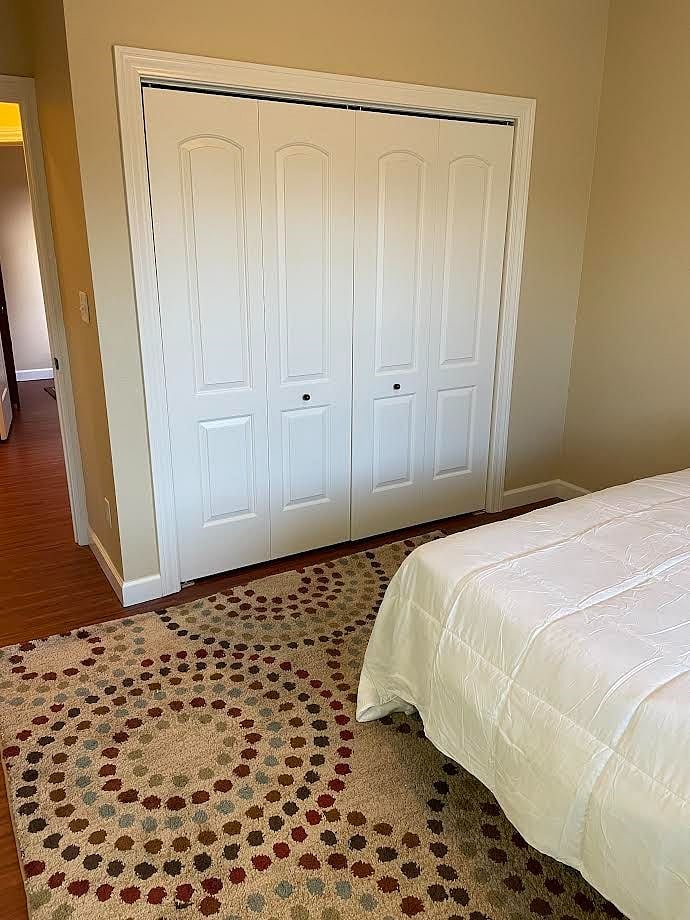 second bedroom with ample closet and chest of drawers