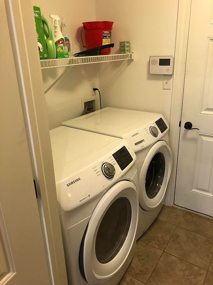 full sized washer and dryer off kitchen