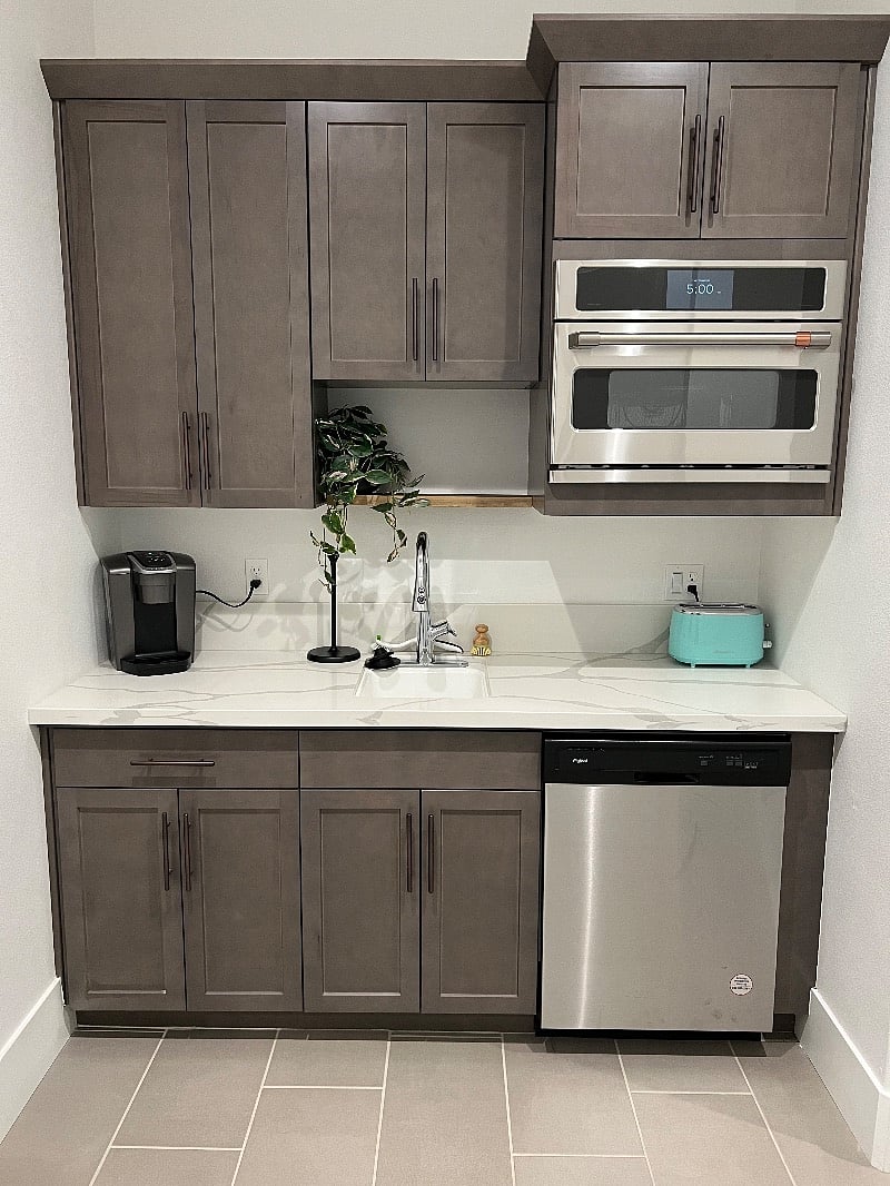 Kurig coffee maker, Toaster and combo microwave and convection oven. Two burner hotplate and all the cookware you need. Kitchenette also comes with a dish washer.
