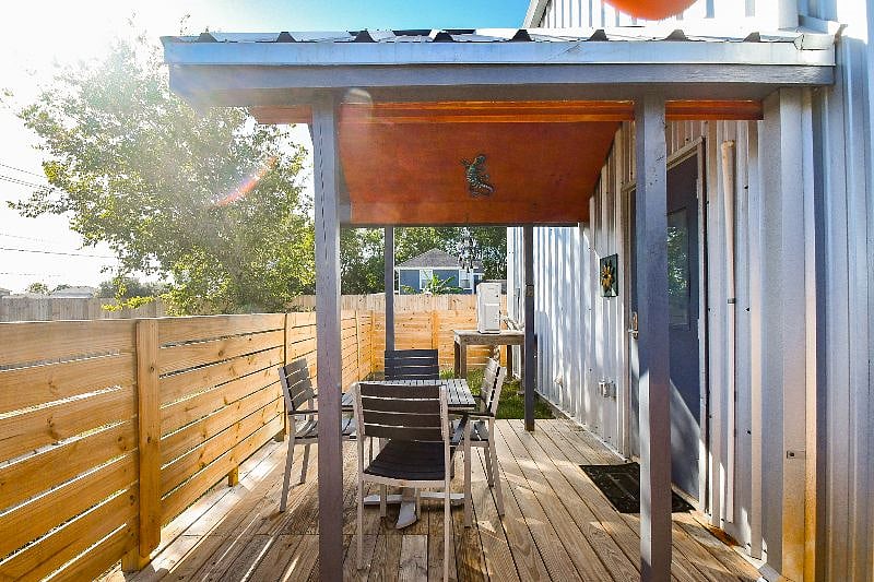Enclosed porch with outdoor furniture
