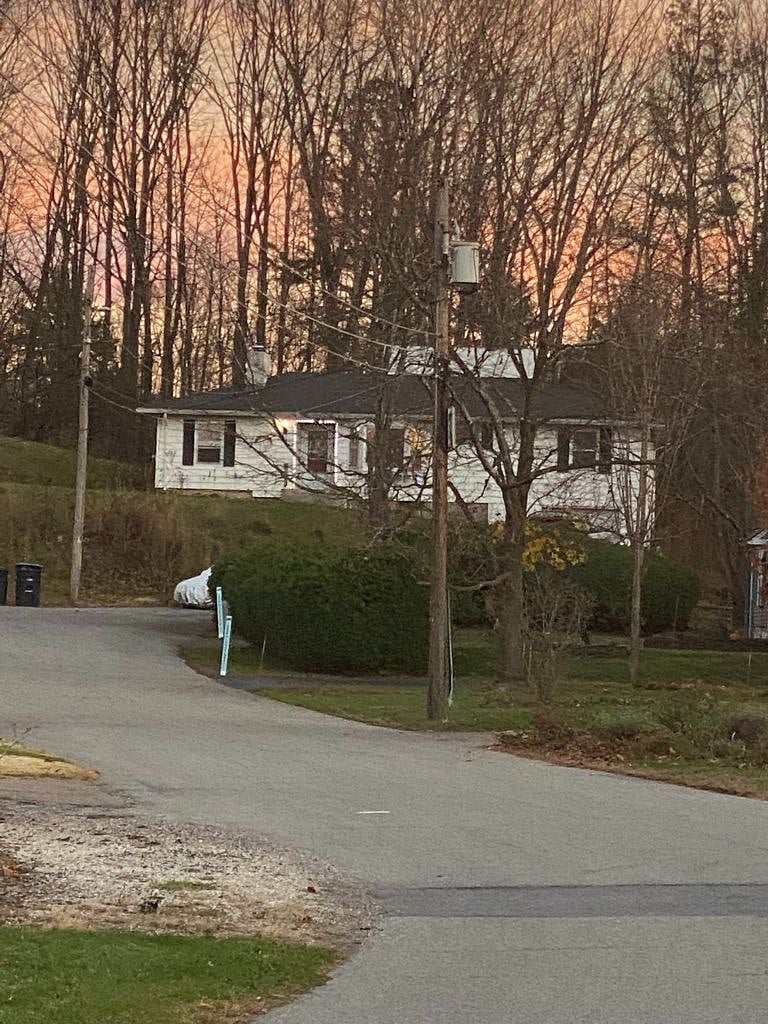 House is located on dead-end street on hill at end of cul-de-sac.