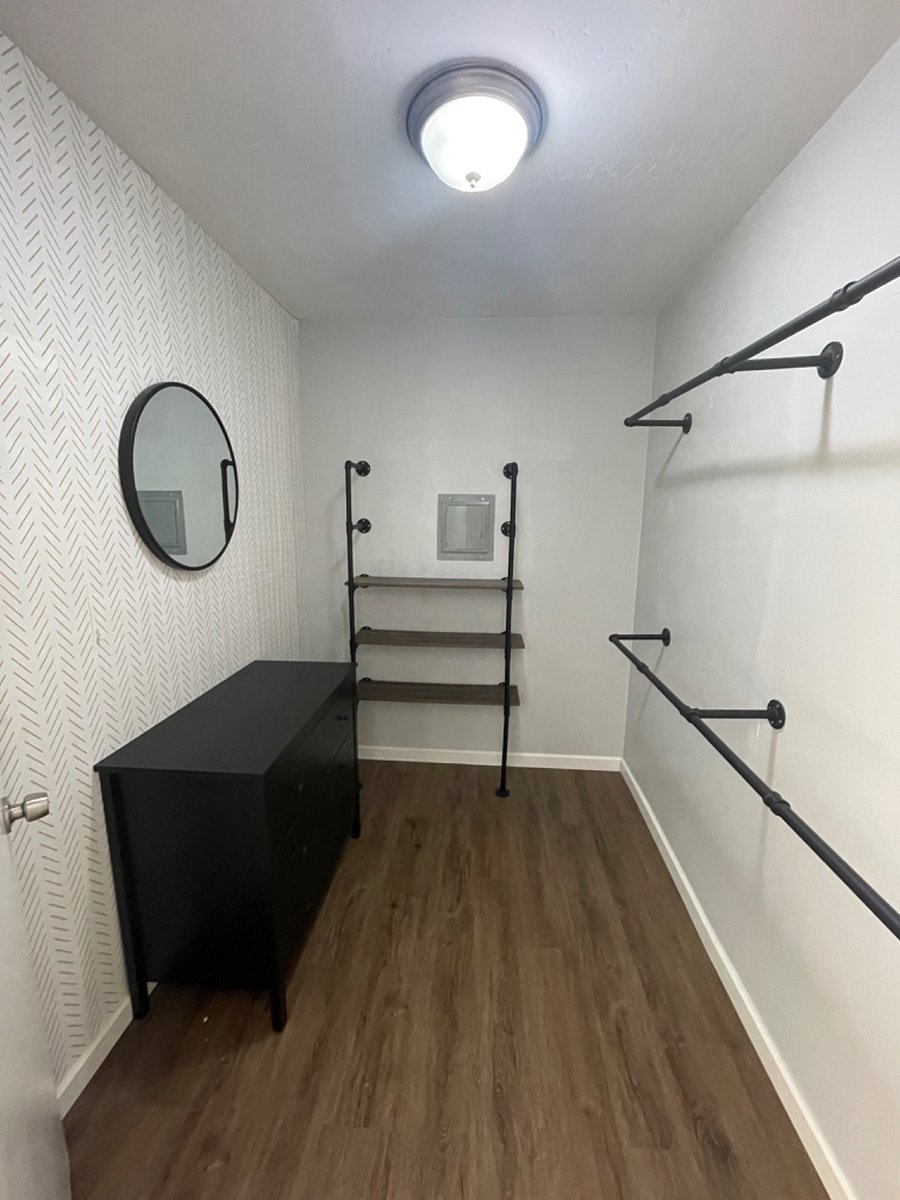 Walk in closet off bedroom