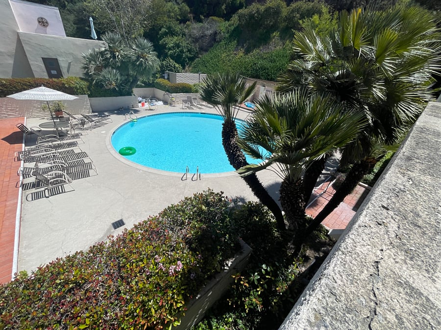View of pool and hot tub from deck