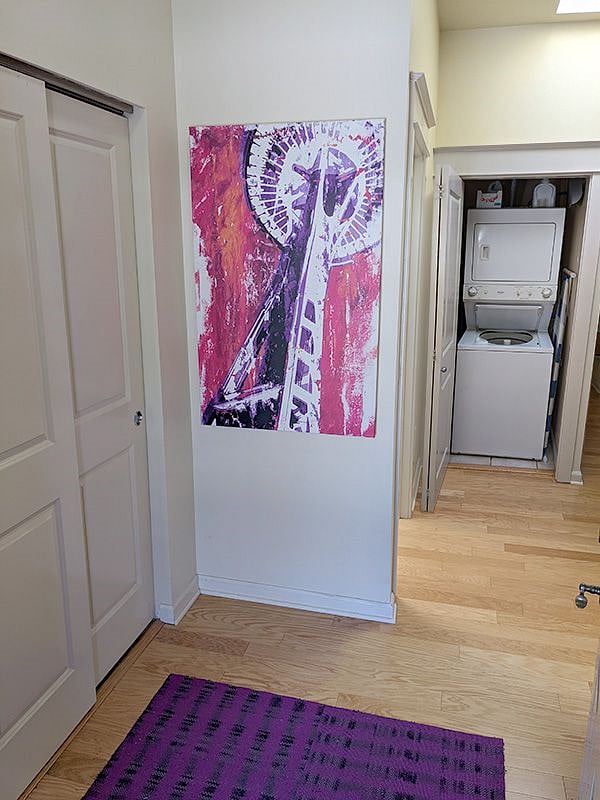 Entry with washer dryer in background