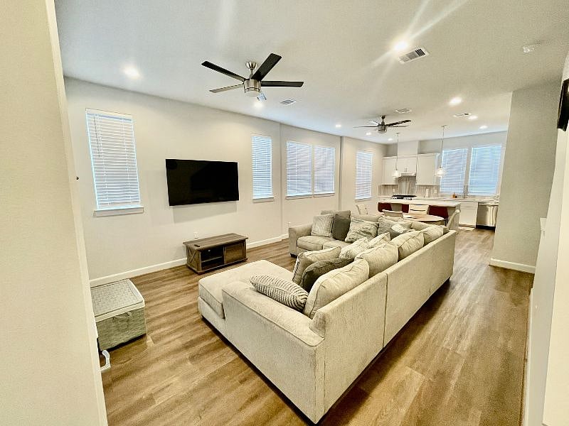 Second floor. Living room, kitchen and dining area. Not pictured: access to outside balcony and study nook with desk and chair. 