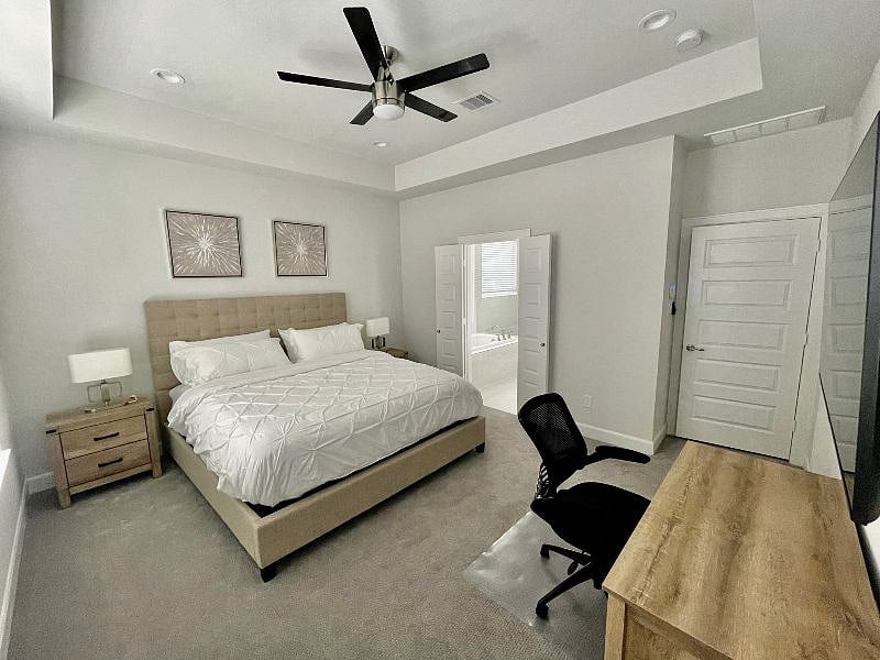 Third floor. Master bedroom with view of the attached master bathroom.