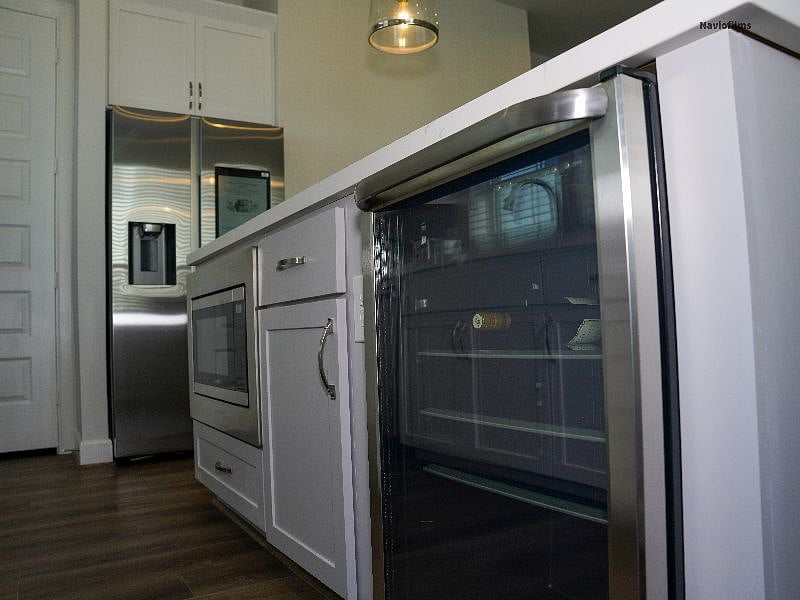Kitchen. Beverage cooler, refrigerator, microwave. 