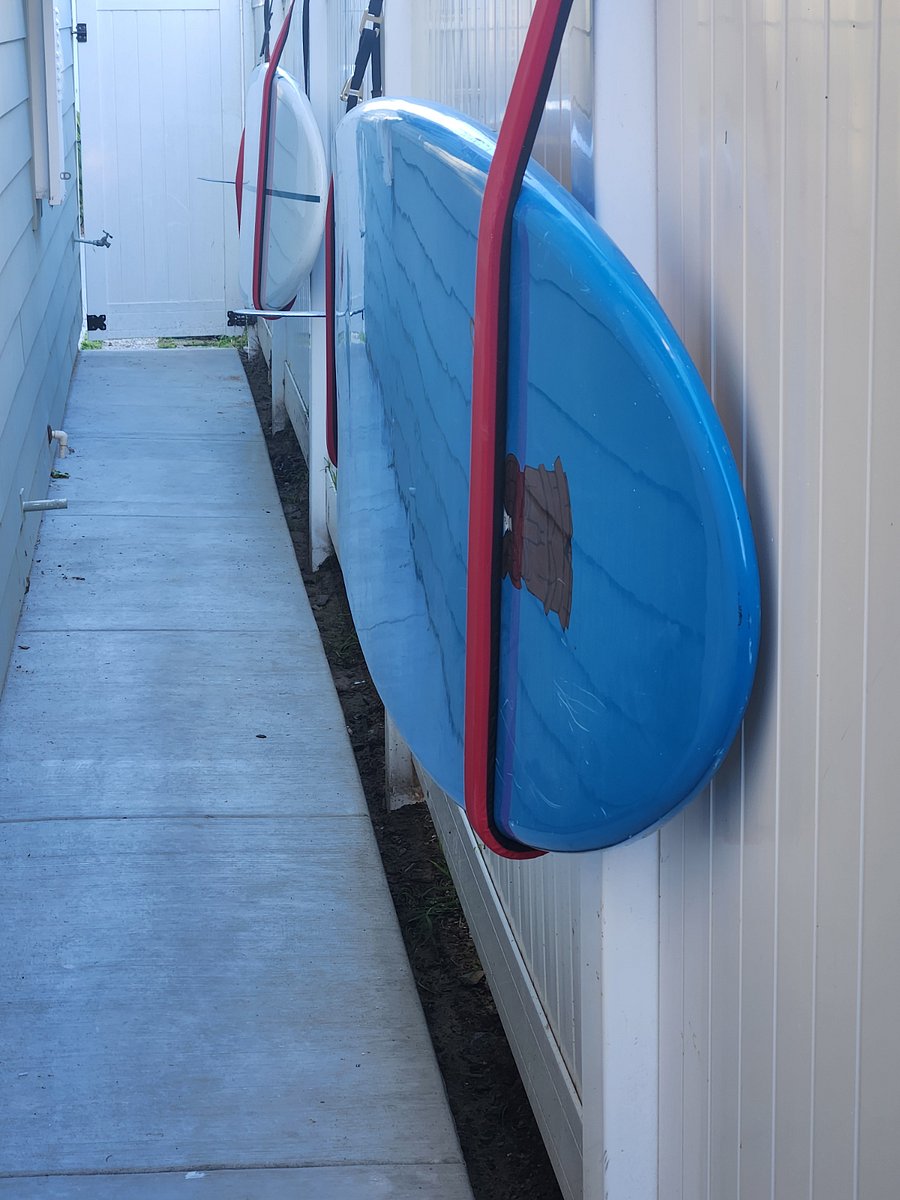 One of the entrance gates with paddle boards to use.Walking distance to beach and beautiful sunsets.