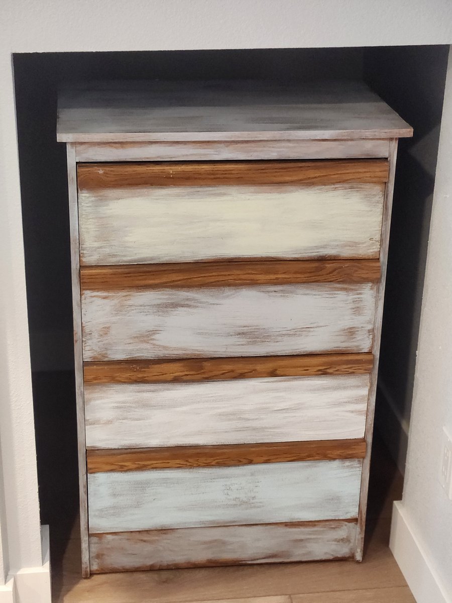 One of two sets of drawers with a large space for storage behind.