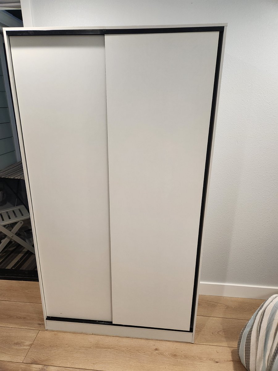 One of two closets. Shelves and room to hang your clothes. Also space on top of closet.