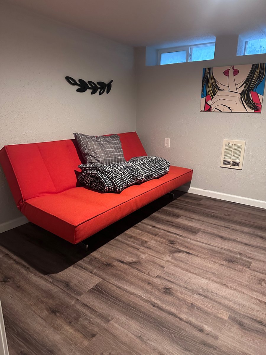 Office with futon and extra linens