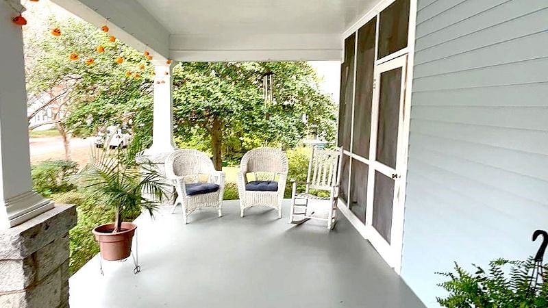 Entrance to the apartment through the screened porch