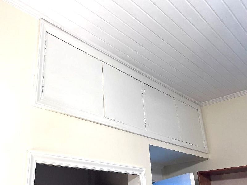 Storage cabinets over the front door