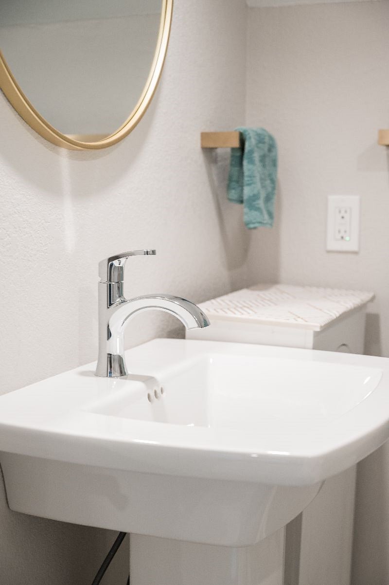 Sink with modern fixtures.