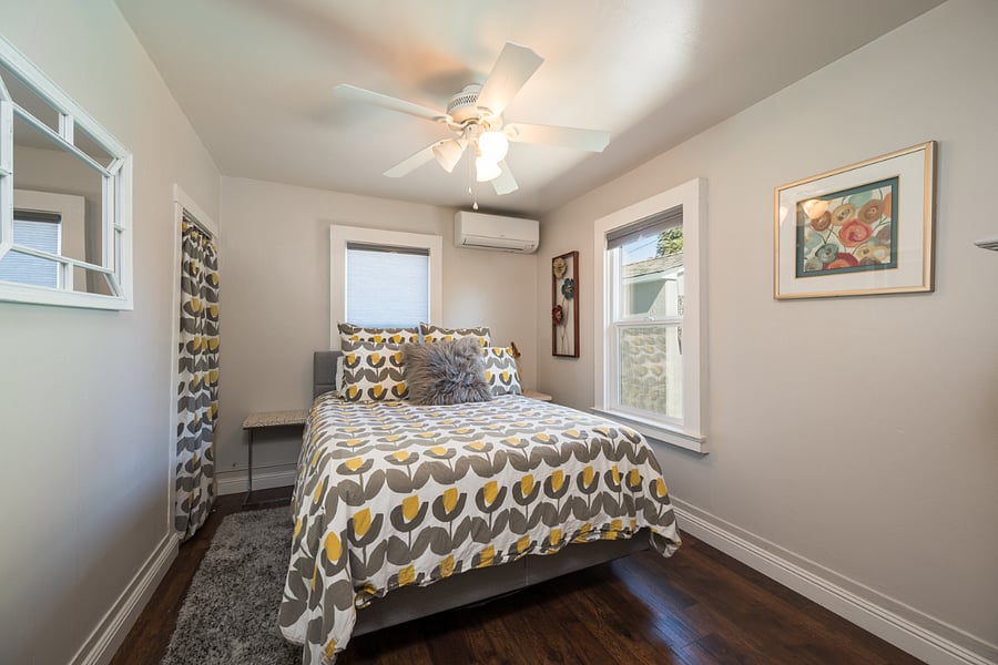 Charming lower level bedroom with comfortable bedding