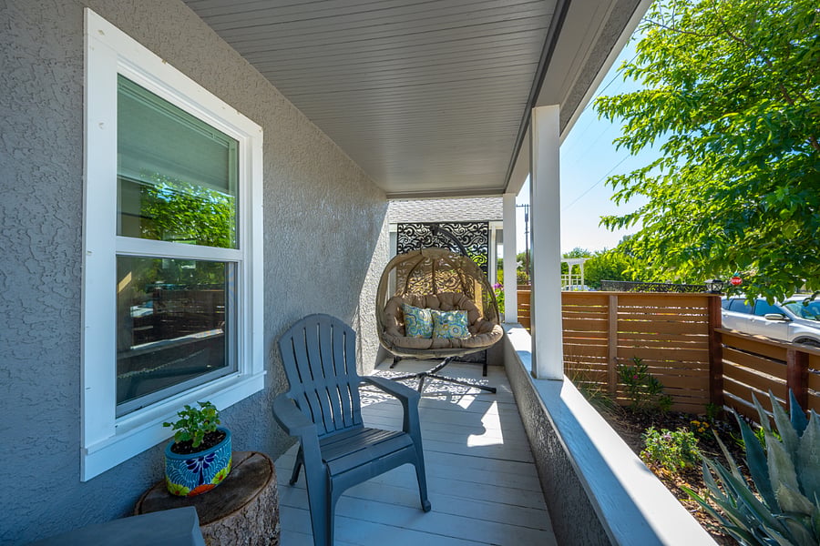 Spacious front porch takes your living area outdoors with ease and comfort