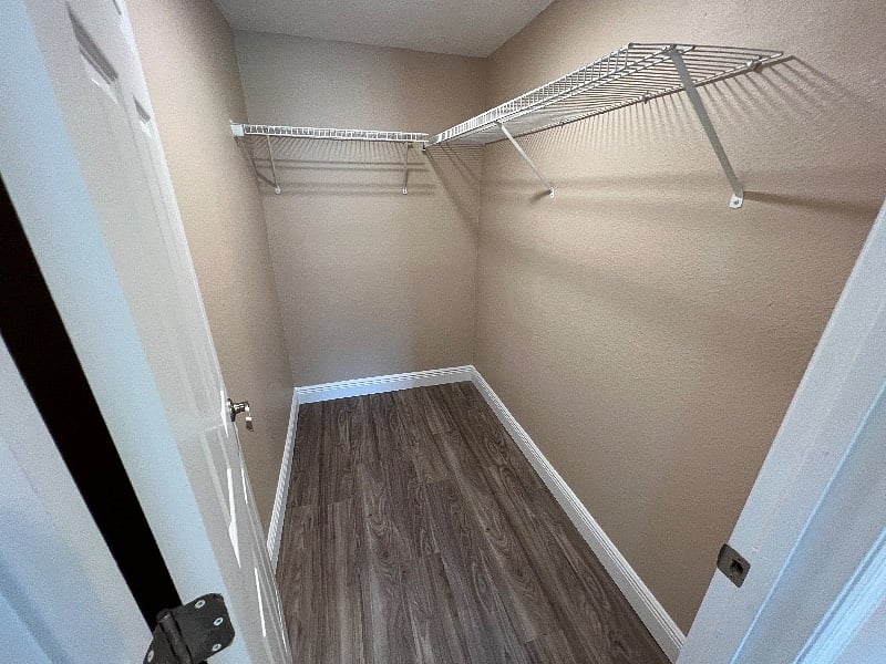 Spacious walk in closet for master bedroom