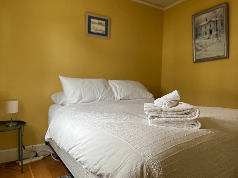 Bedroom 2 includes a queen bed and black-out curtains.