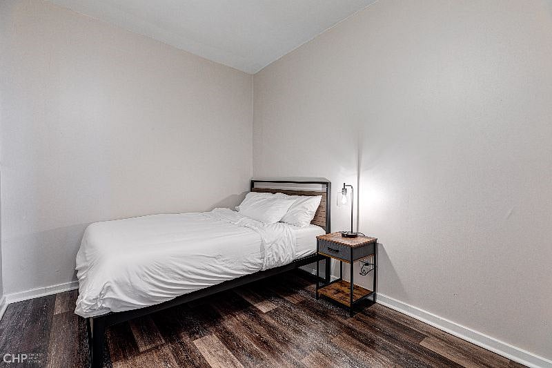Large rear bedroom with queen size bed