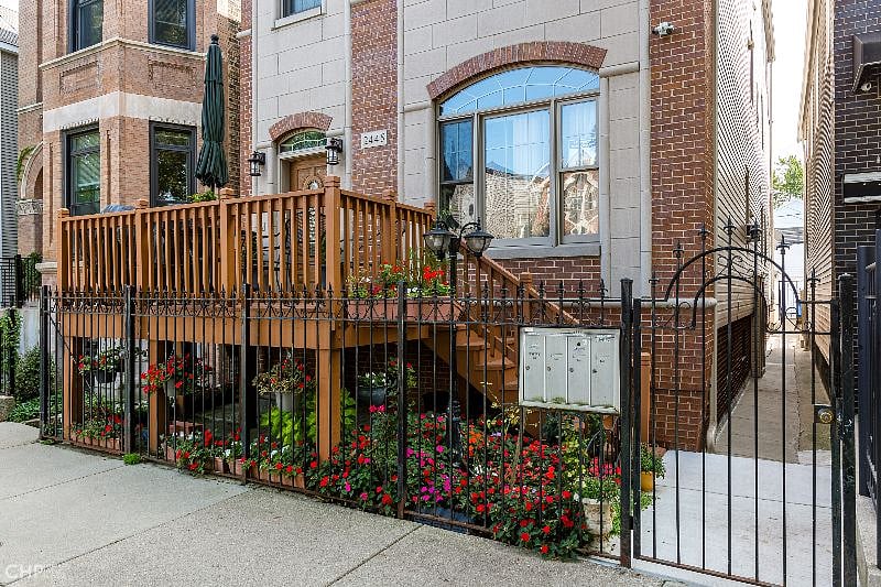 Enter through this fence gate, which is unlocked. Reach through to unlatch top latch if needed. Unit entrance is in rear of property.