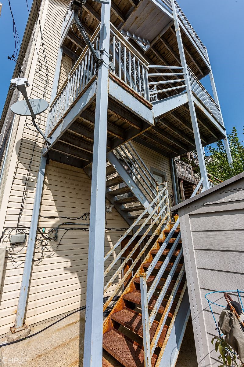 Rear porch stairs, walk up 3 flights of stairs to Unit 2R.