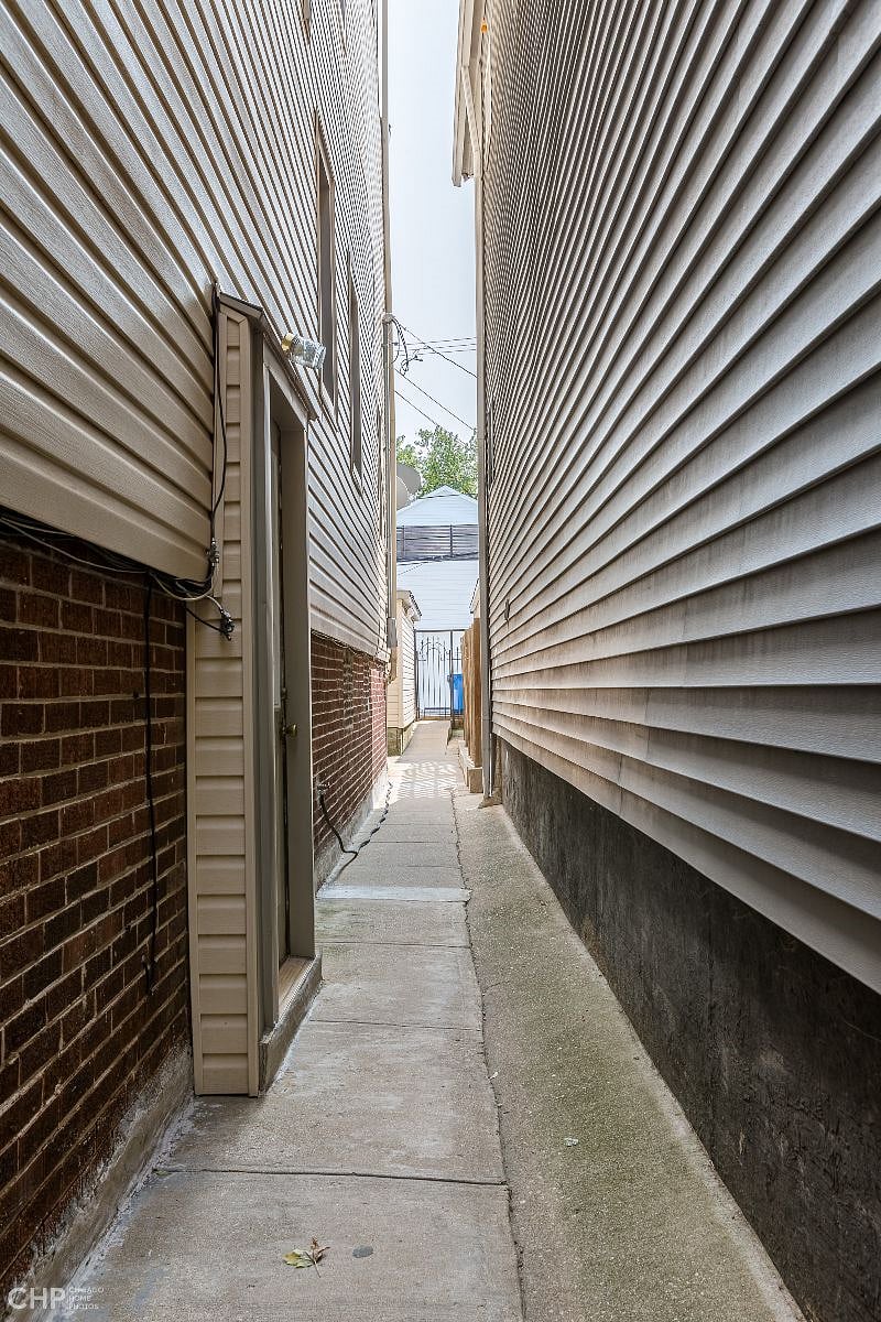 Walkway to the rear. Walk all the way to the rear porch stairs.