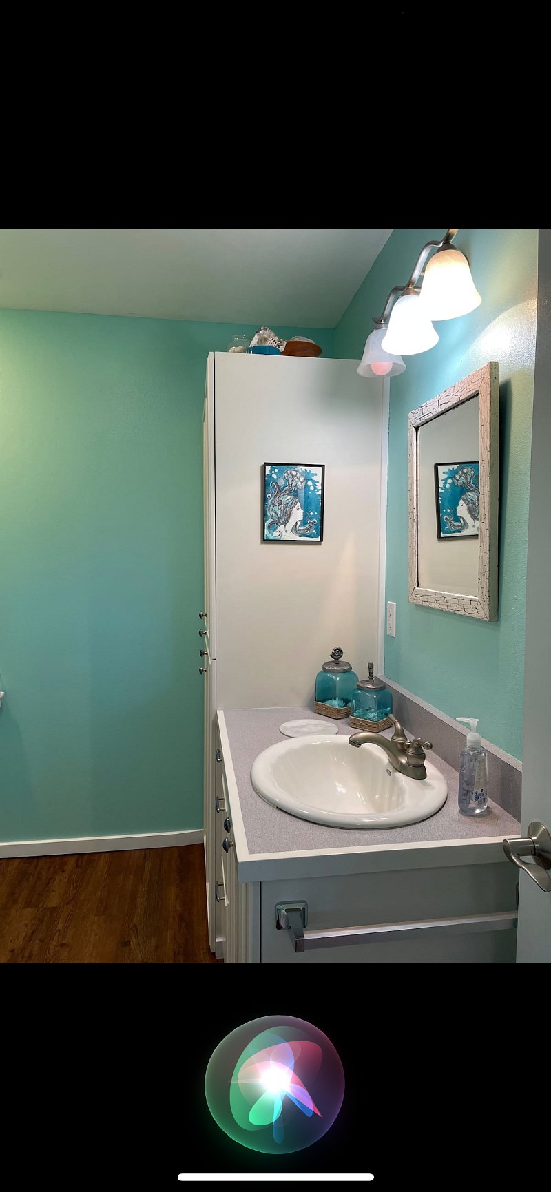 The bathroom is done in a beach theme! 