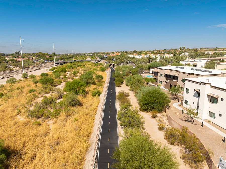 The Chuck Huckelberry Loop Trail (60 miles long paved trial) / Walking distance. This trail is great for walking, biking or walk your way towards St. Phillips Plaza Restaurants and Shoppes.  [5 min walk]. (Access through condominium complex gate)