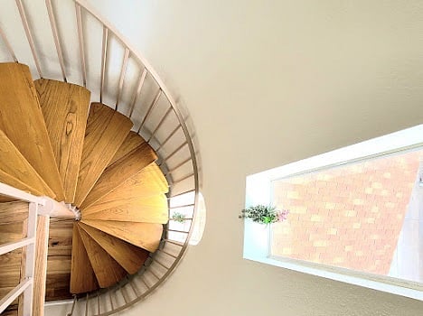 Artistic spiral stairs to each level
