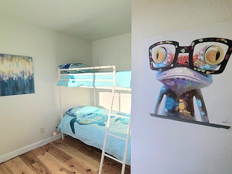 Second floor bedroom with twin bunk beds and full closet