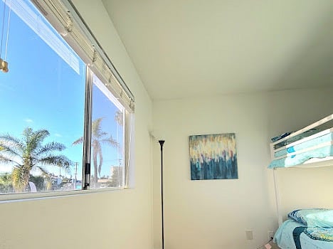 Second floor bedroom with twin bunk beds and full closet