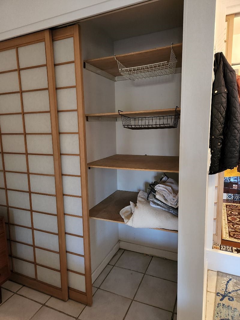 Downstairs closet. Hanging pole is on left side