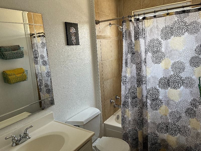 Main bathroom has a tub and shower.