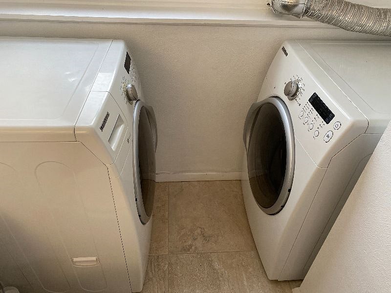 Full-size front-loading Samsung appliances.