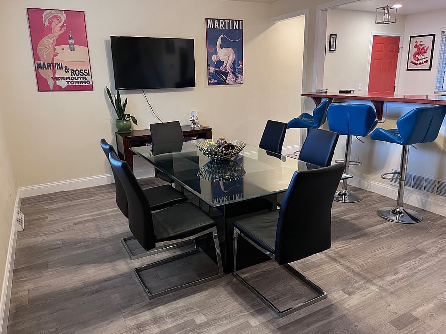 Dining area for 6 with 52 inch mounted smart TV.