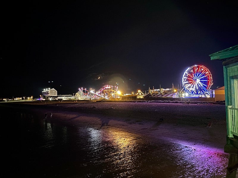 Palace playland lit up at night.
