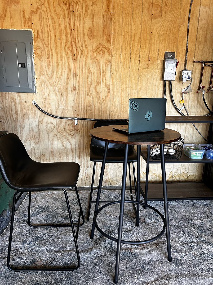 In Unit Laundry Area with Tall Table and stools.