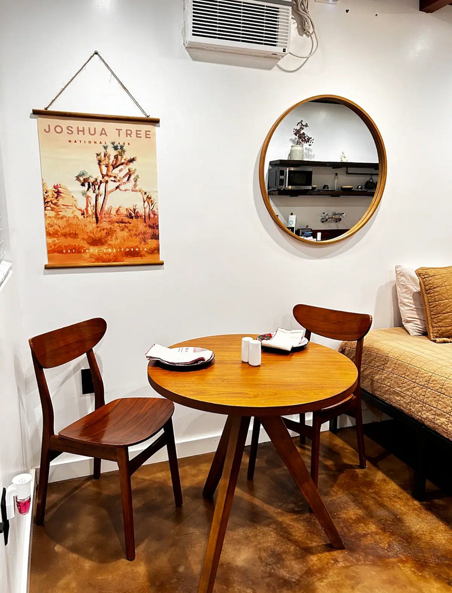 Beautiful NEW West Elm Bistro table with two almond color wooden chairs.