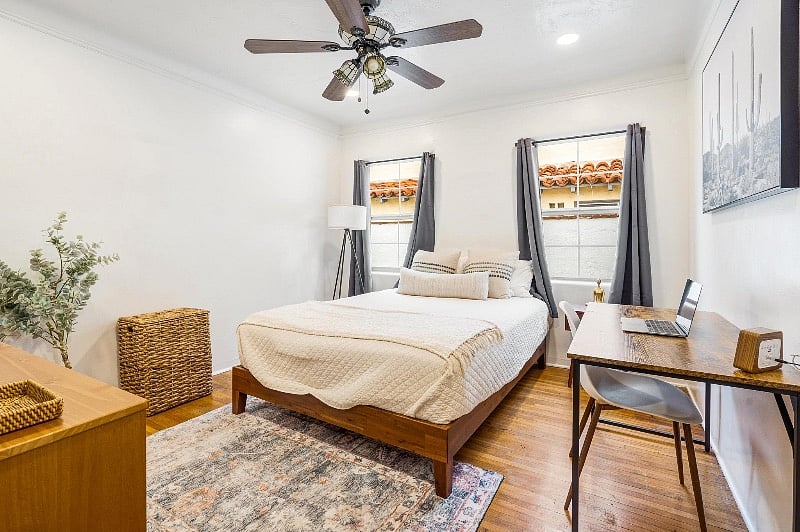 Bedroom 1, Queen Bed with Desk, Closet, Hamper, 32 inch smart TV, dresser and black out curtains.
