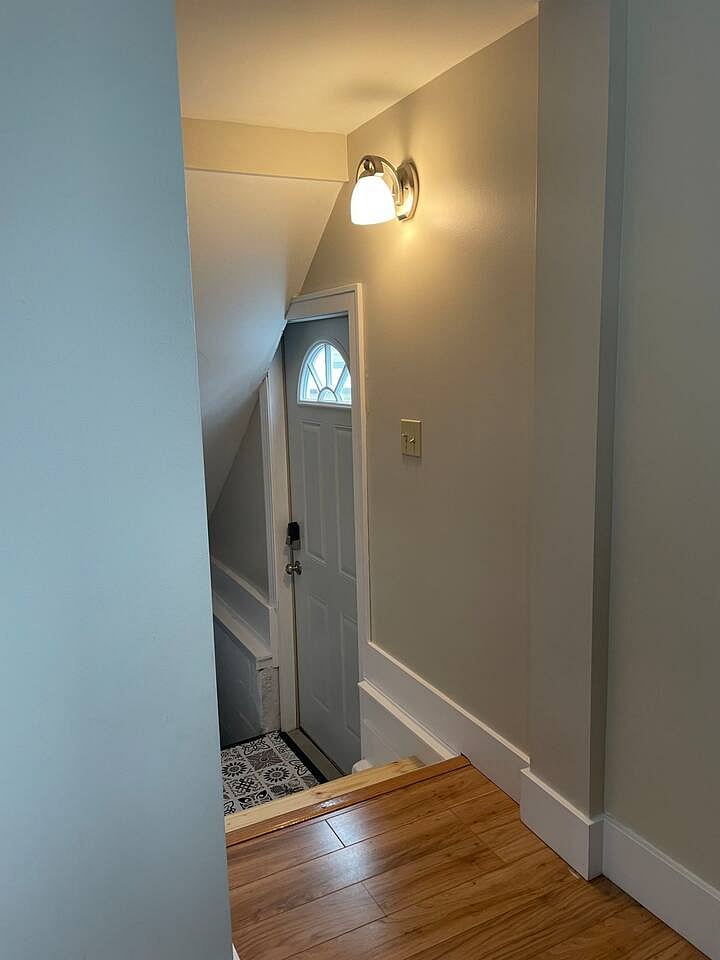 Driveway side entry. Stairs up to kitchen, stairs down to basement
