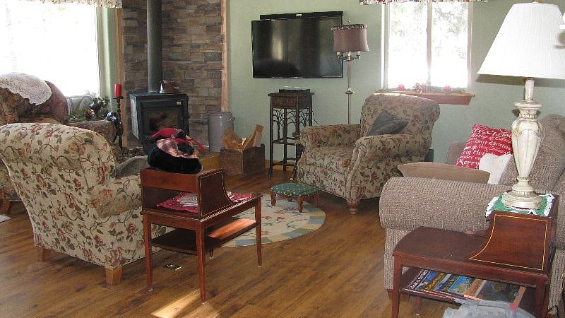Front room with comfy chairs and wood stove.